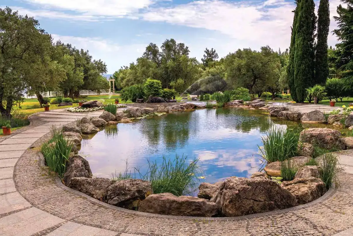 Landscaped pond area at TVS Emerald Altura